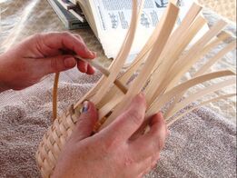 Artist weaving basket