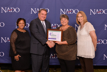 Presentation of NADO Innovation Award. From Left to Right: Cotina Terry, 2nd Vice President of Tour East Alabama; NADO 2014-2015 Board President Terry Bobrowski, Executive Director of the East Tennessee Development District in Alcoa, TN; Mary Patchunka-Smith, TMP President of Tour East Alabama; Tammy Power 1st Vice President of Tour East Alabama.