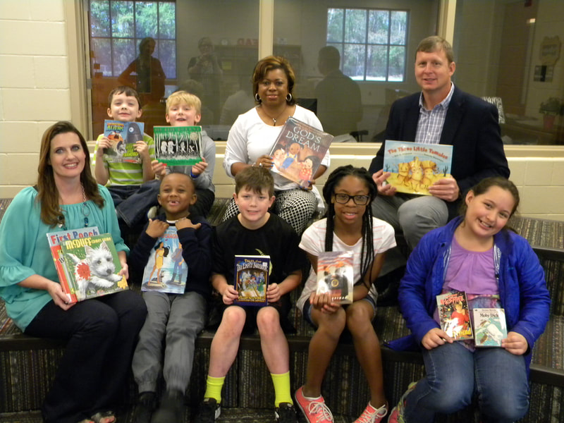 Moundville Elementary , Hale County children and staff showing books donated