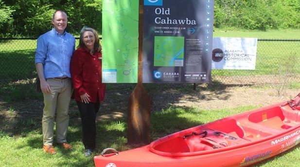 People standing by upright sign Cahaba Blueway Old Cahawba