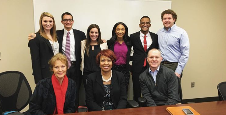 Six University of Alabama students and three advisors
