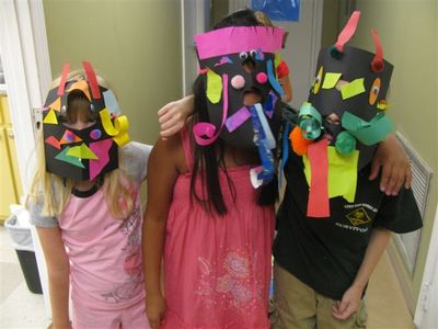 Black Belt Treasures Cultural Arts Center Summer Art Camp participants display masks
